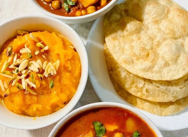 Halwa-Puri Paratha-Aloo Cholay Platter.